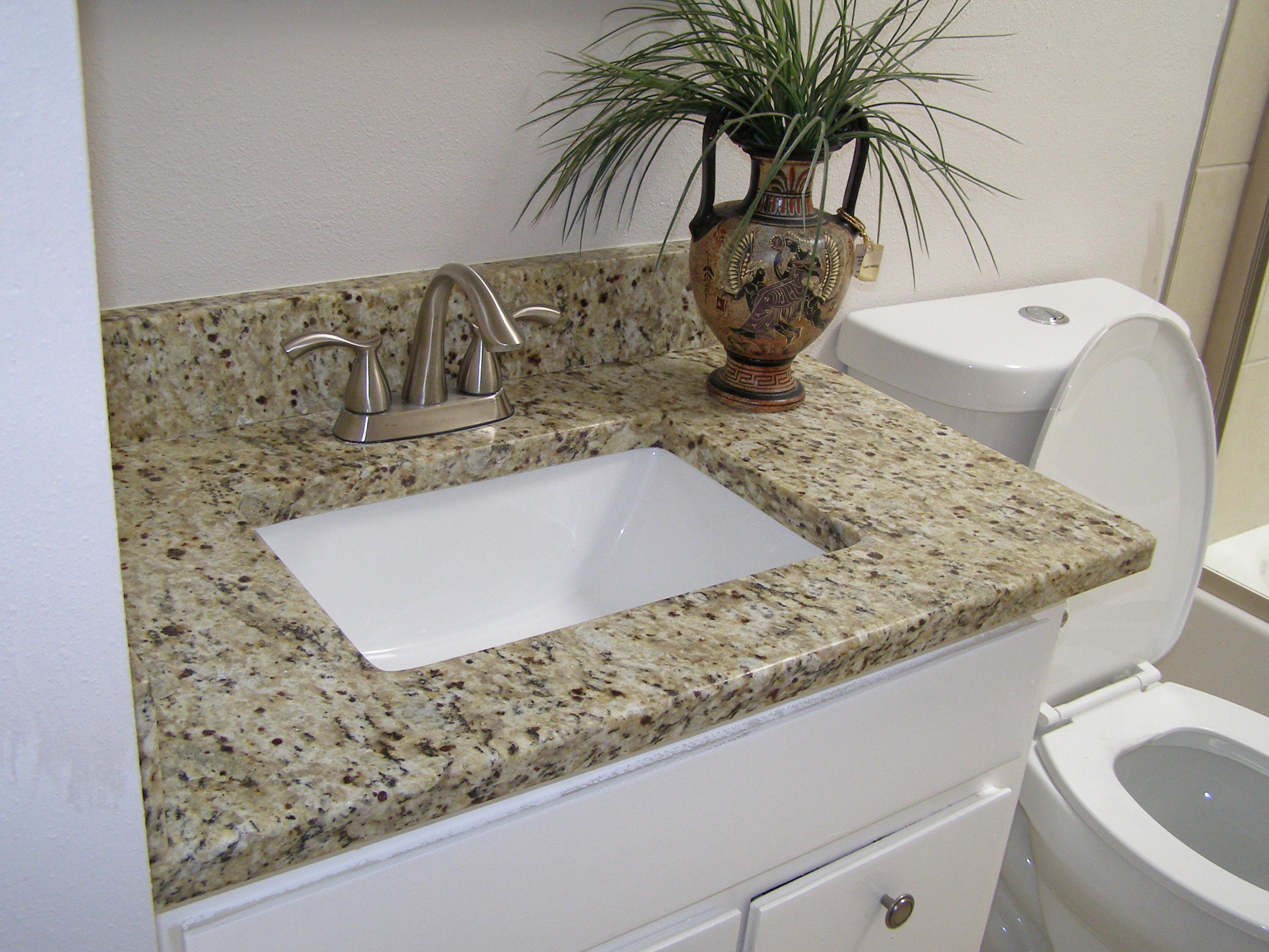 3356 Auburn Road Crestview, FL 32539 - Photo 18 of 34 a bathroom with a granite countertop sink and a mirror