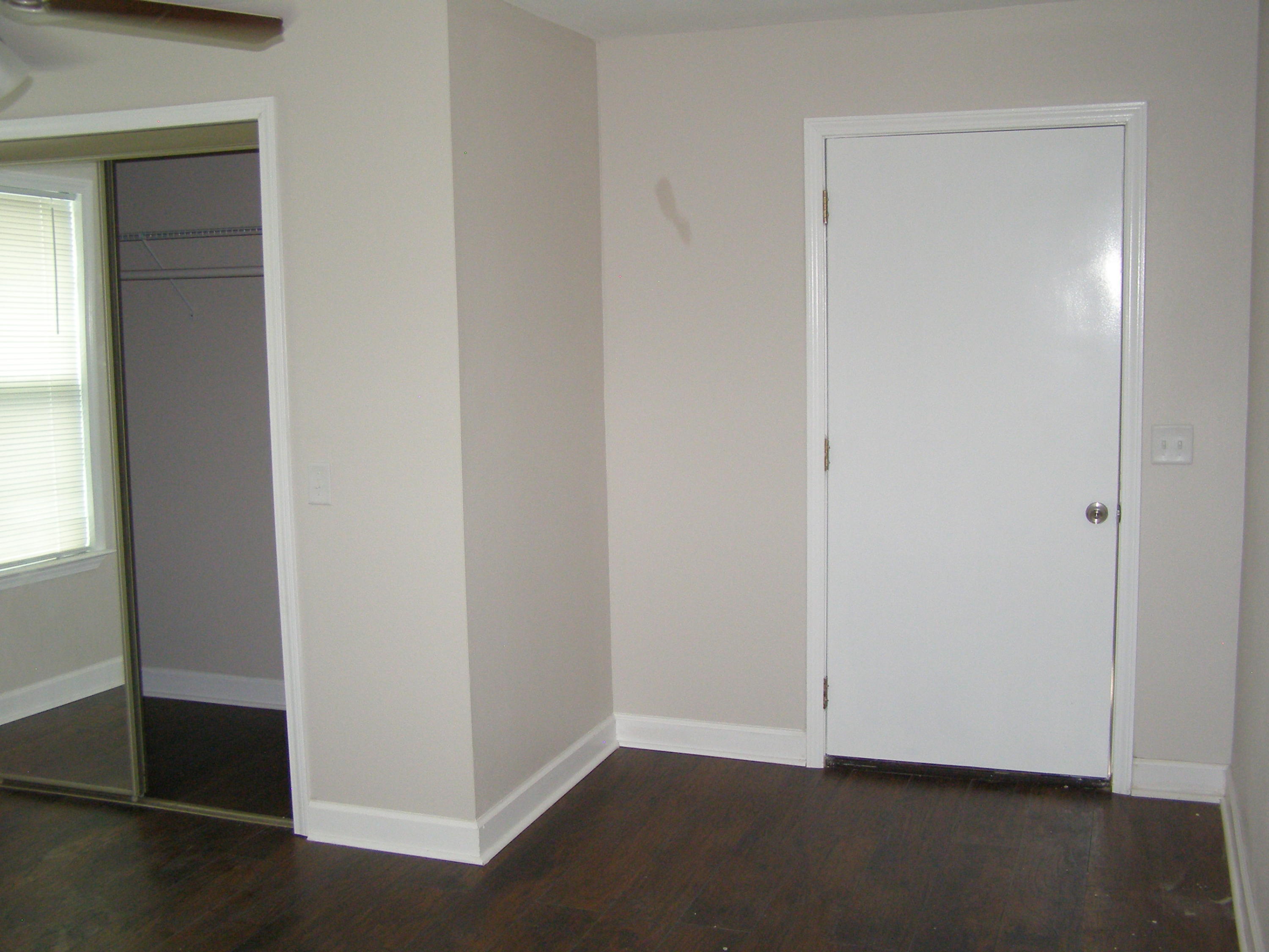3356 Auburn Road Crestview, FL 32539 - Photo 23 of 34 an empty room with wooden floor closet and windows