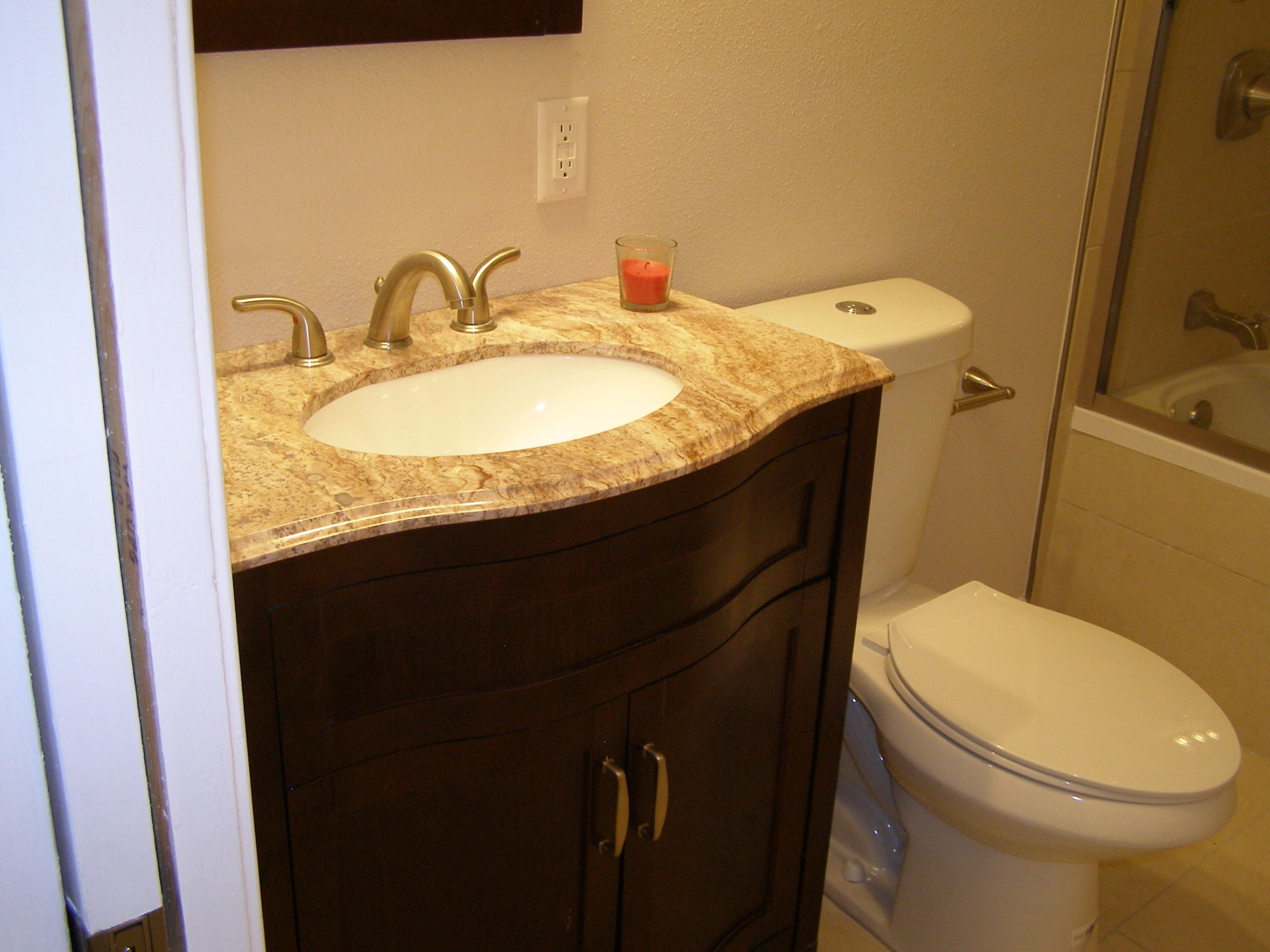 3356 Auburn Road Crestview, FL 32539 - Photo 24 of 34 a bathroom with a granite countertop sink toilet and mirror