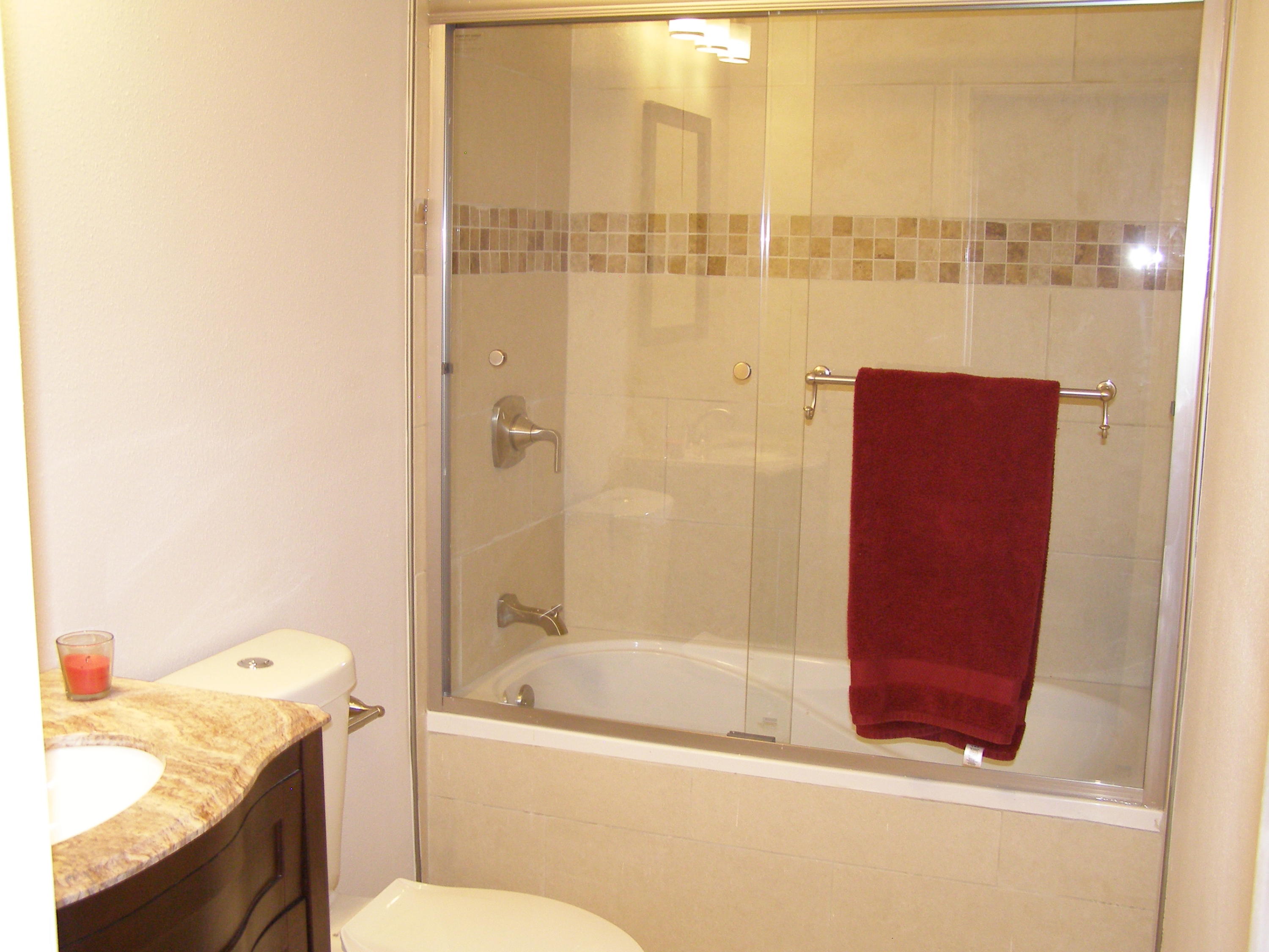 3356 Auburn Road Crestview, FL 32539 - Photo 26 of 34 a bathroom with a granite countertop bathtub shower sink vanity and toilet