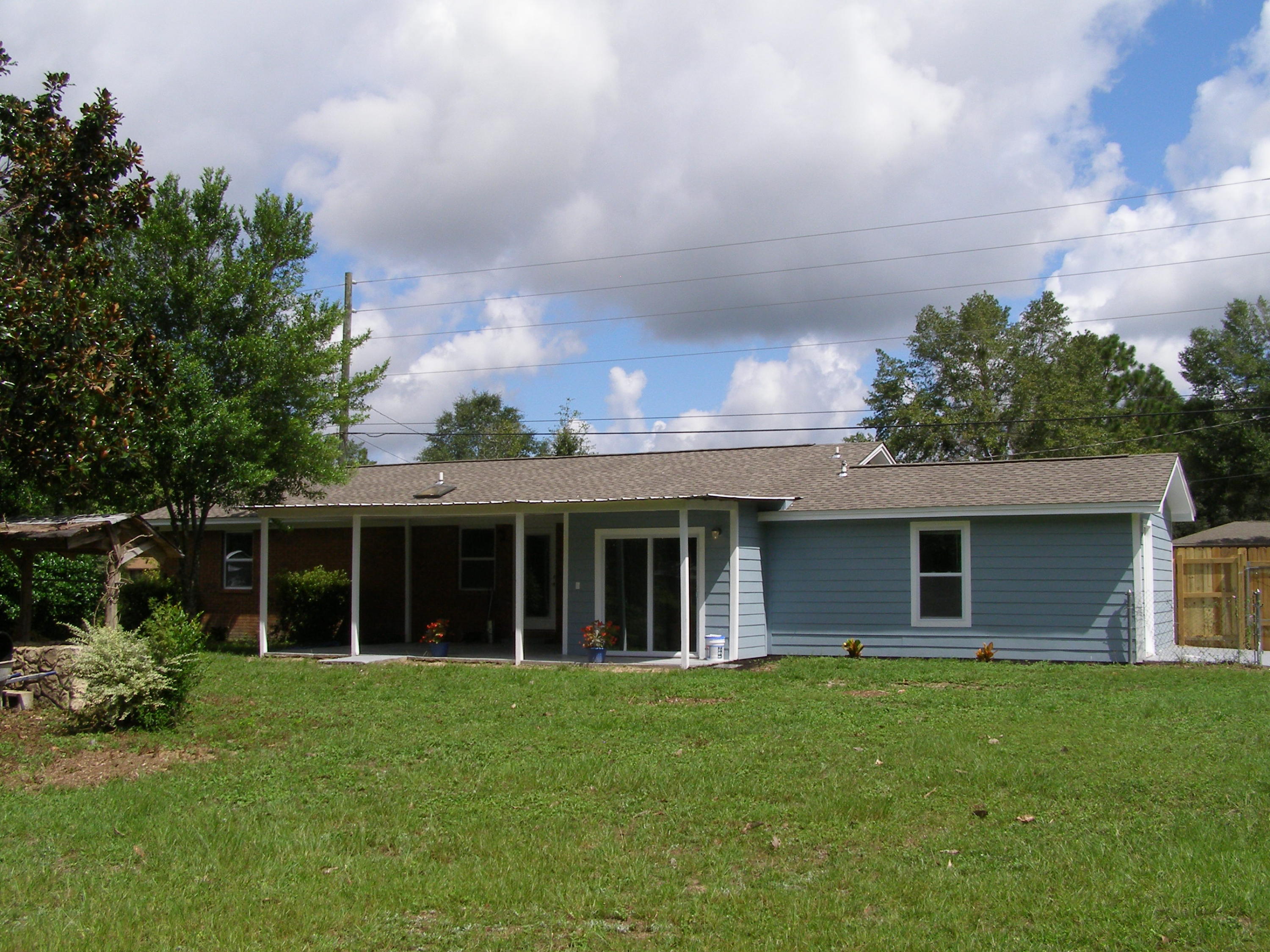 3356 Auburn Road Crestview, FL 32539 - Photo 30 of 34 a view of a house with a backyard