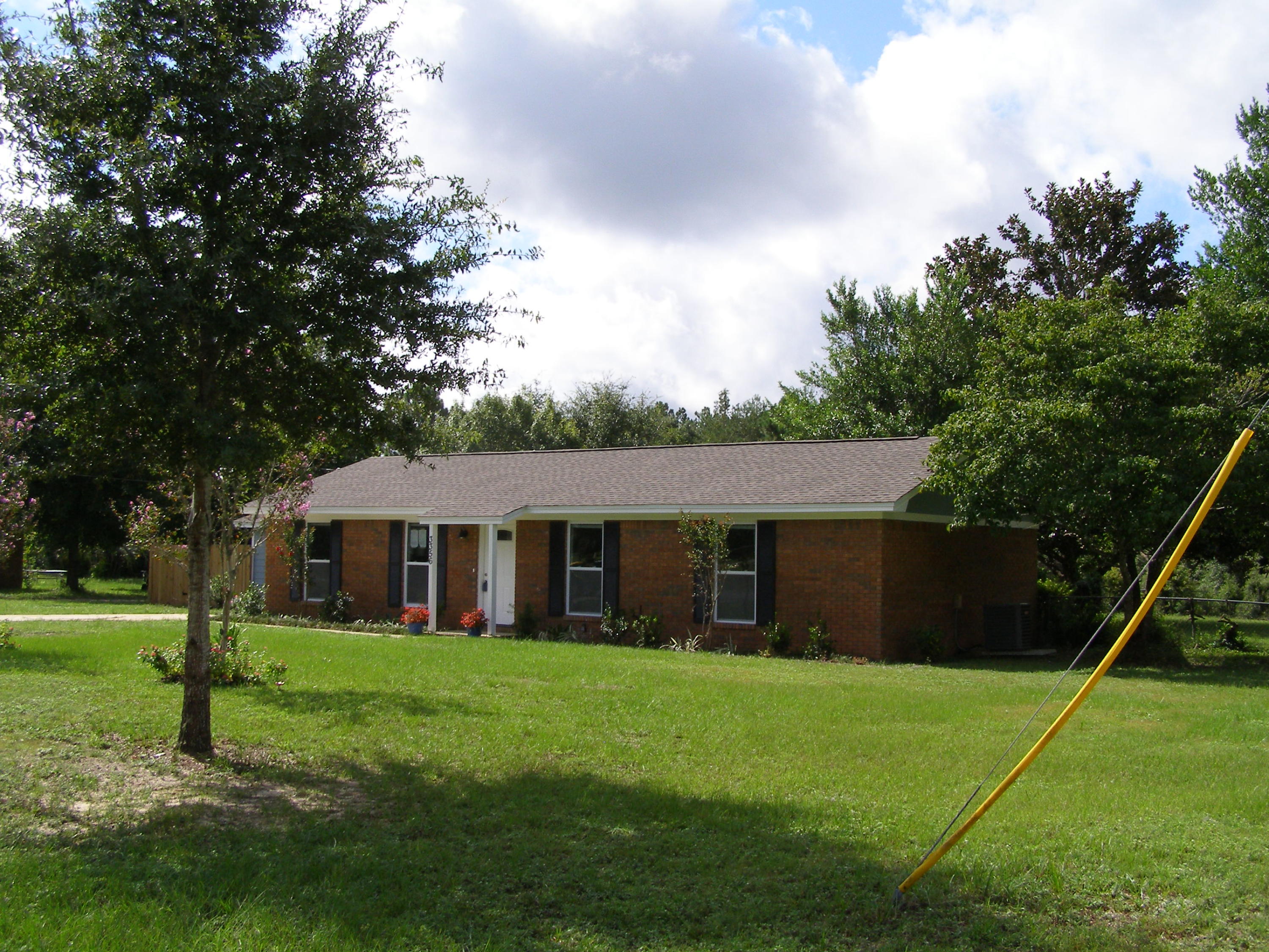 3356 Auburn Road Crestview, FL 32539 - Photo 33 of 34 a view of a house with a backyard