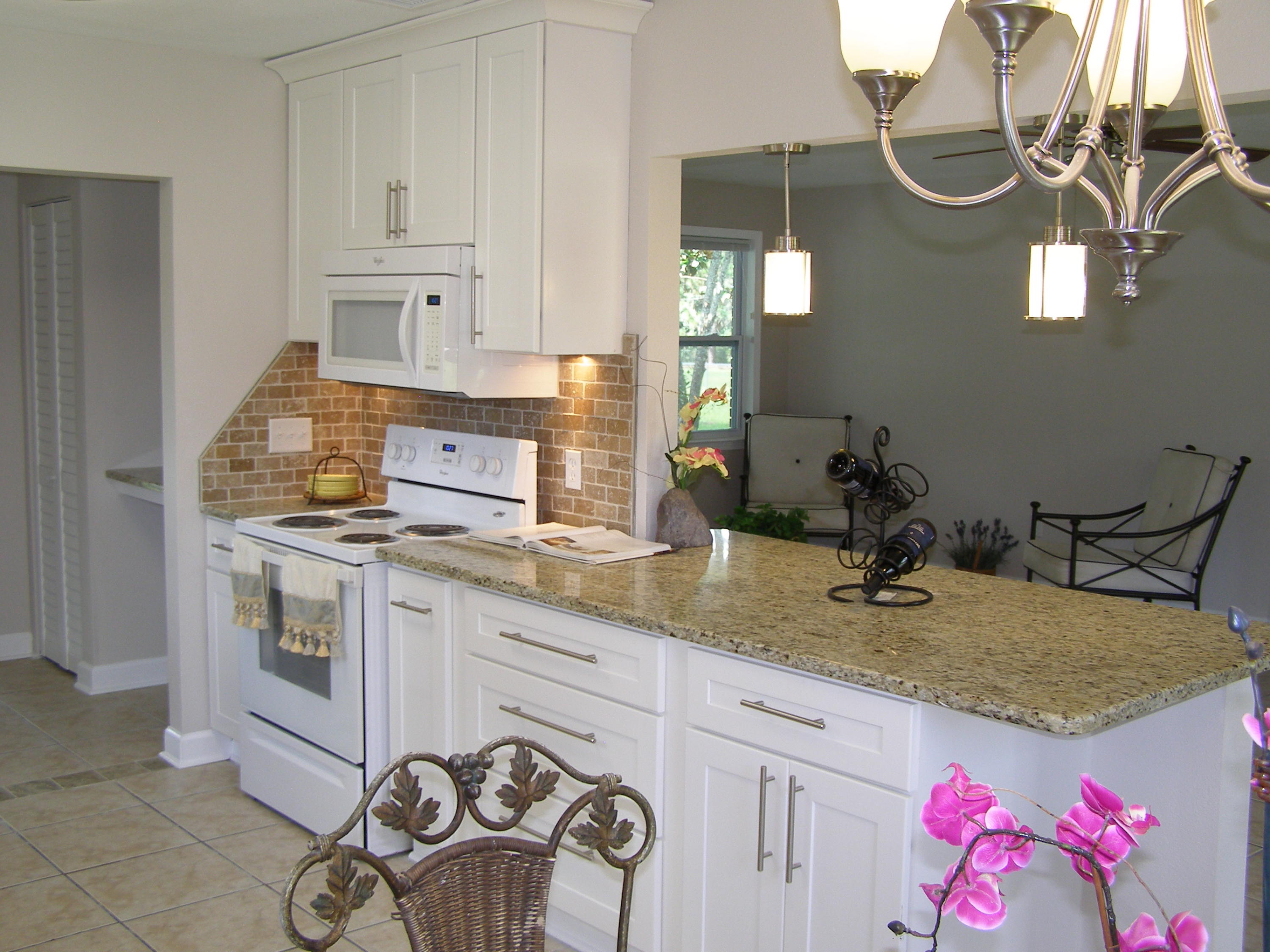3356 Auburn Road Crestview, FL 32539 - Photo 9 of 34 a kitchen with a sink and cabinets