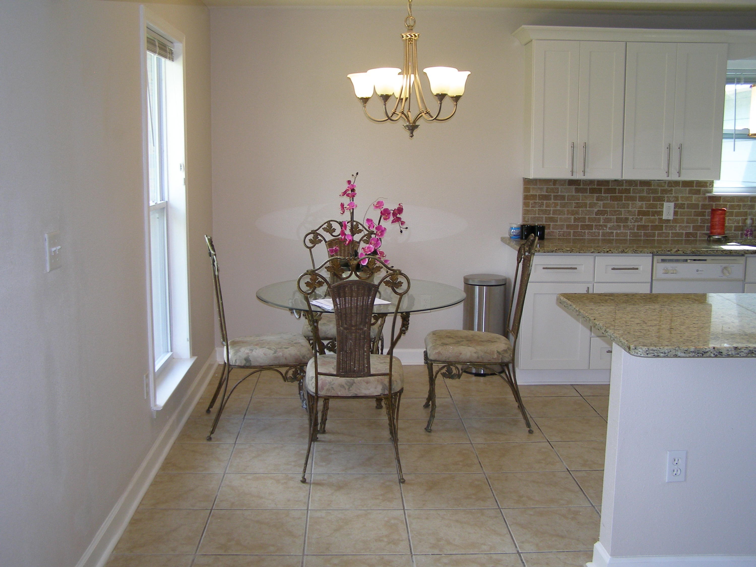 3356 Auburn Road Crestview, FL 32539 - Photo 10 of 34 a view of a dining room with furniture and chandelier