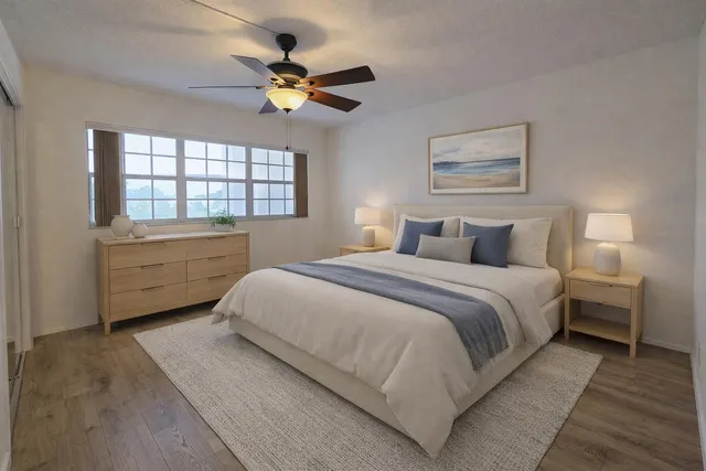 a bedroom with a bed and a window