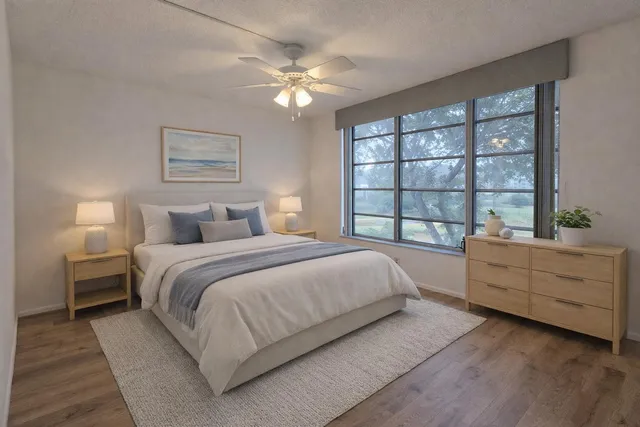 a bedroom with a large bed and a window