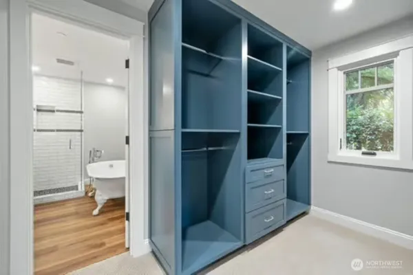 a view of an empty room with glass door