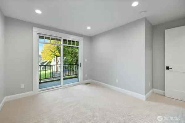 a bathroom with a white bathtub and a toilet