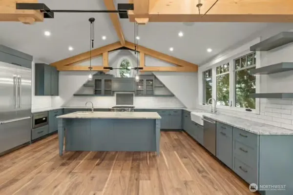 a kitchen with a sink and a stove