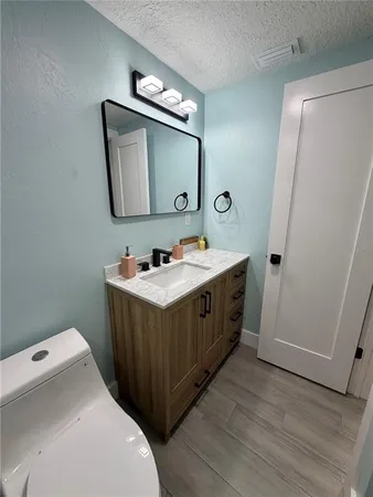 a bathroom with a double vanity sink and mirror