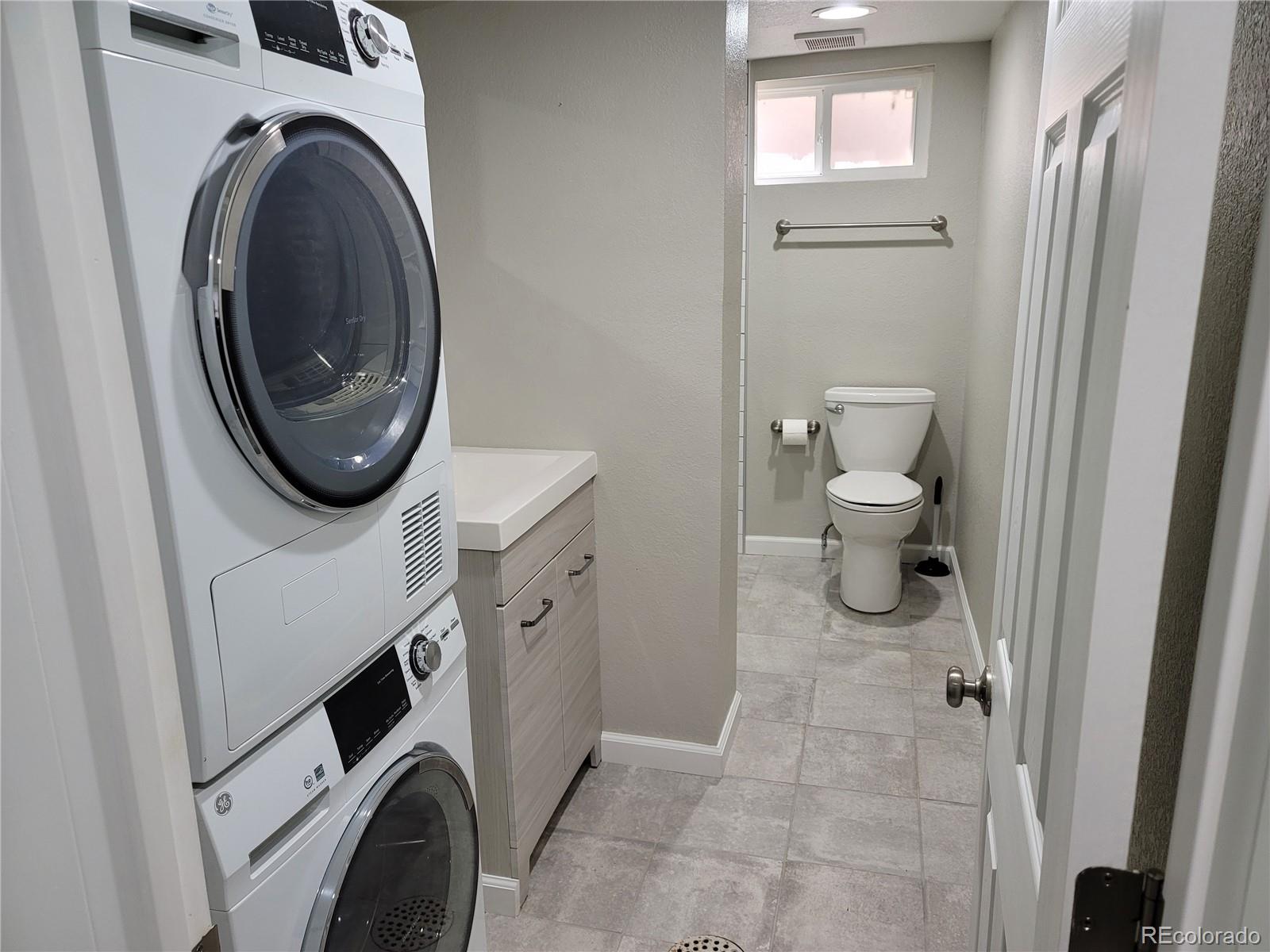 2834 Curtis Street, Unit 3 Denver, CO 80205 - Photo 18 of 22 a bathroom with a toilet and a sink