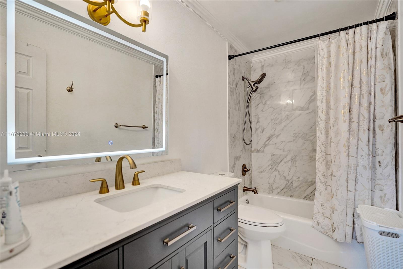 9737 Alaska Circle Boca Raton, FL 33434 - Photo 14 of 37 a bathroom with a sink a toilet and shower