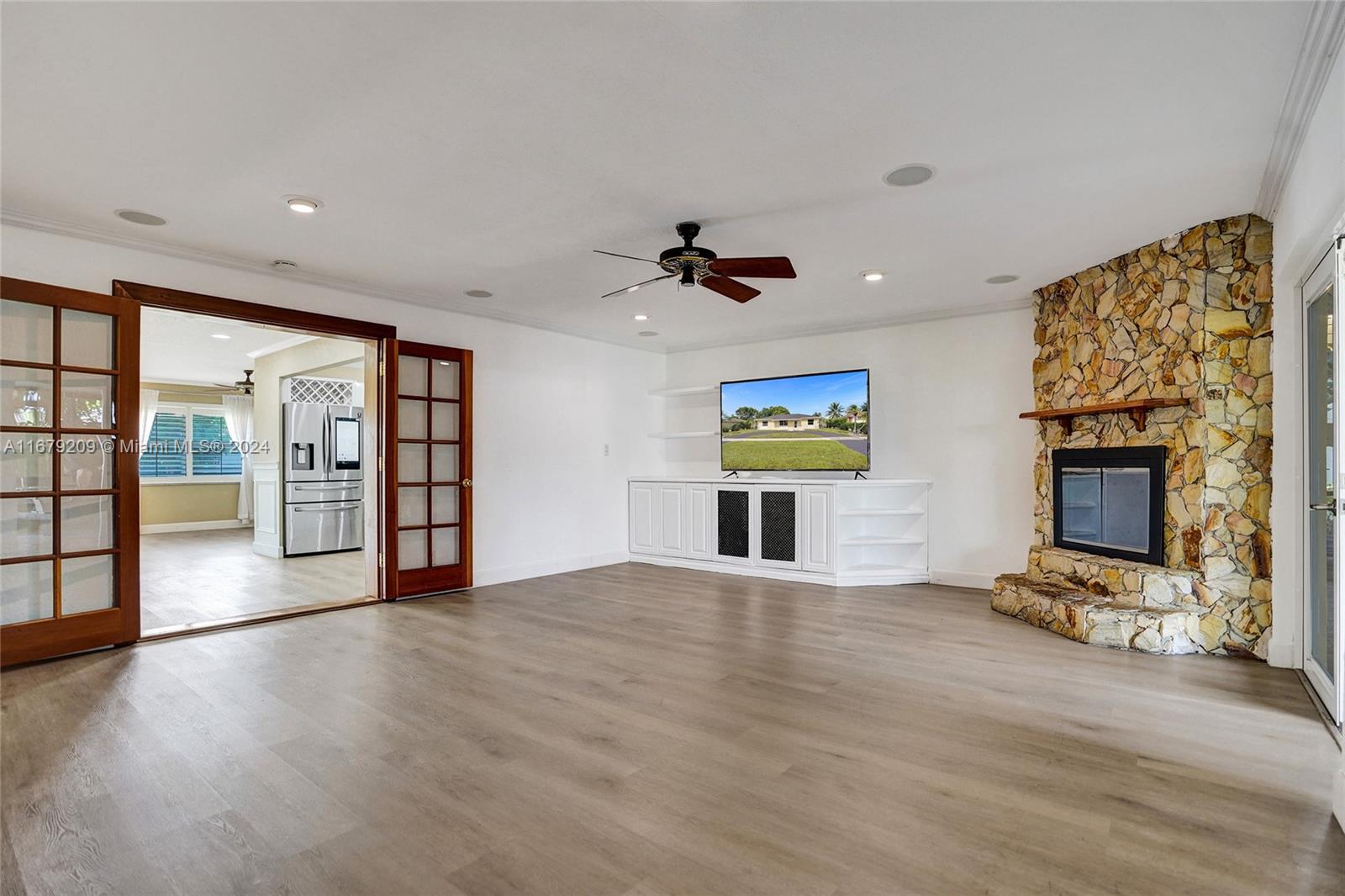 9737 Alaska Circle Boca Raton, FL 33434 - Photo 21 of 37 a view of an empty room with a fireplace and a window