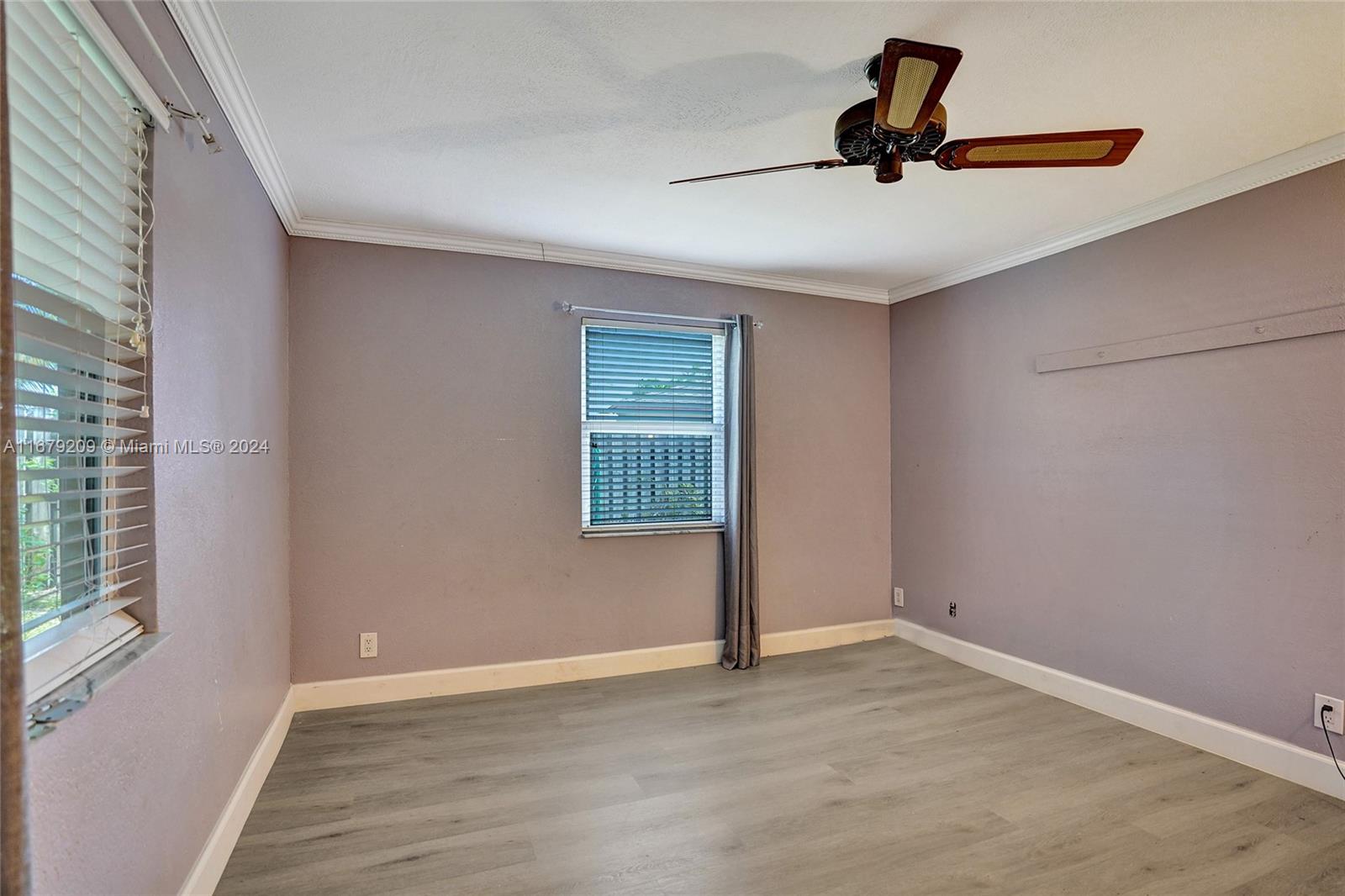 9737 Alaska Circle Boca Raton, FL 33434 - Photo 23 of 37 a view of empty room with windows