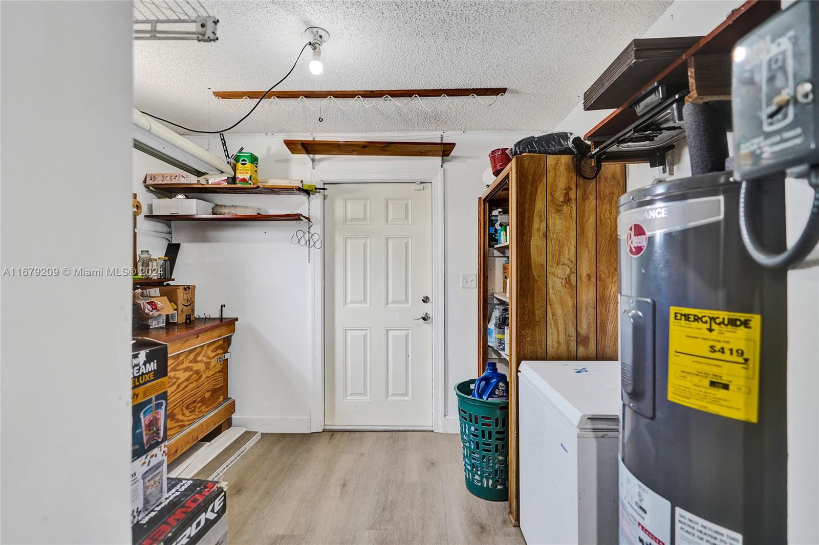 9737 Alaska Circle Boca Raton, FL 33434 - Photo 24 of 37 a view of walk in closet with clothes and shoes