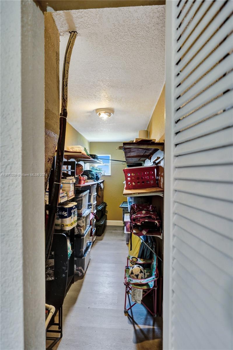 9737 Alaska Circle Boca Raton, FL 33434 - Photo 26 of 37 a view of a room with racks on the wall