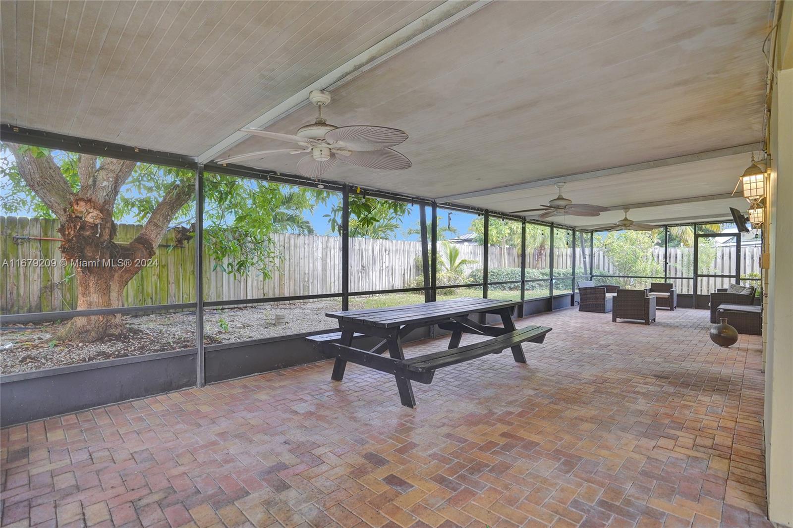 9737 Alaska Circle Boca Raton, FL 33434 - Photo 29 of 37 a swimming pool with outdoor seating and yard in the back