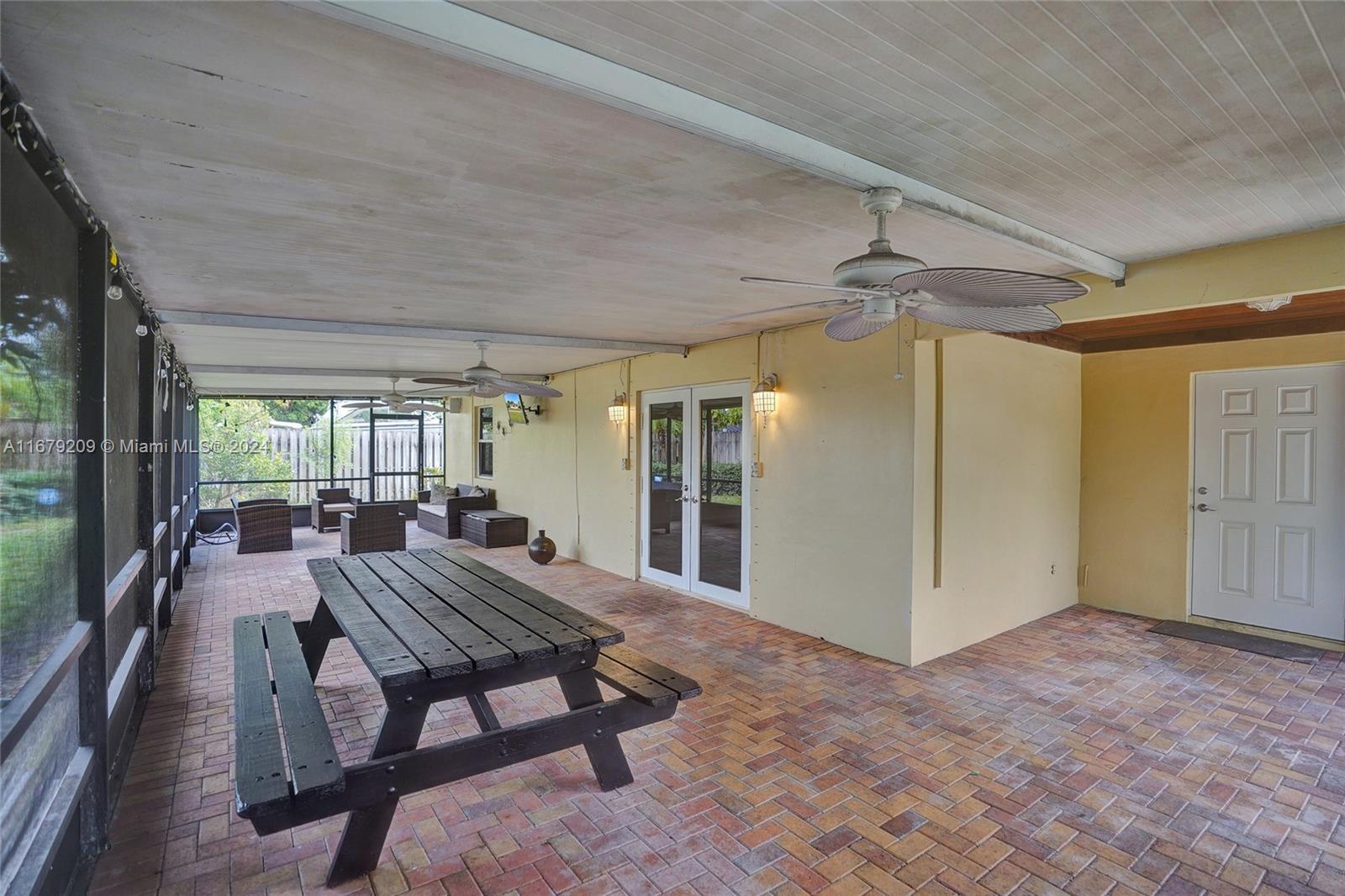 9737 Alaska Circle Boca Raton, FL 33434 - Photo 35 of 37 a view of a patio with a table and chairs