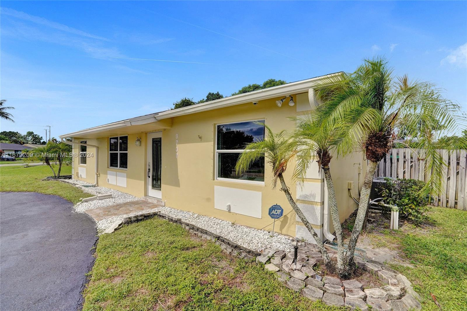 9737 Alaska Circle Boca Raton, FL 33434 - Photo 36 of 37 a view of a house with backyard