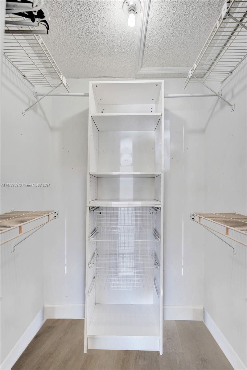 9737 Alaska Circle Boca Raton, FL 33434 - Photo 7 of 37 a view of walk in closet with empty racks