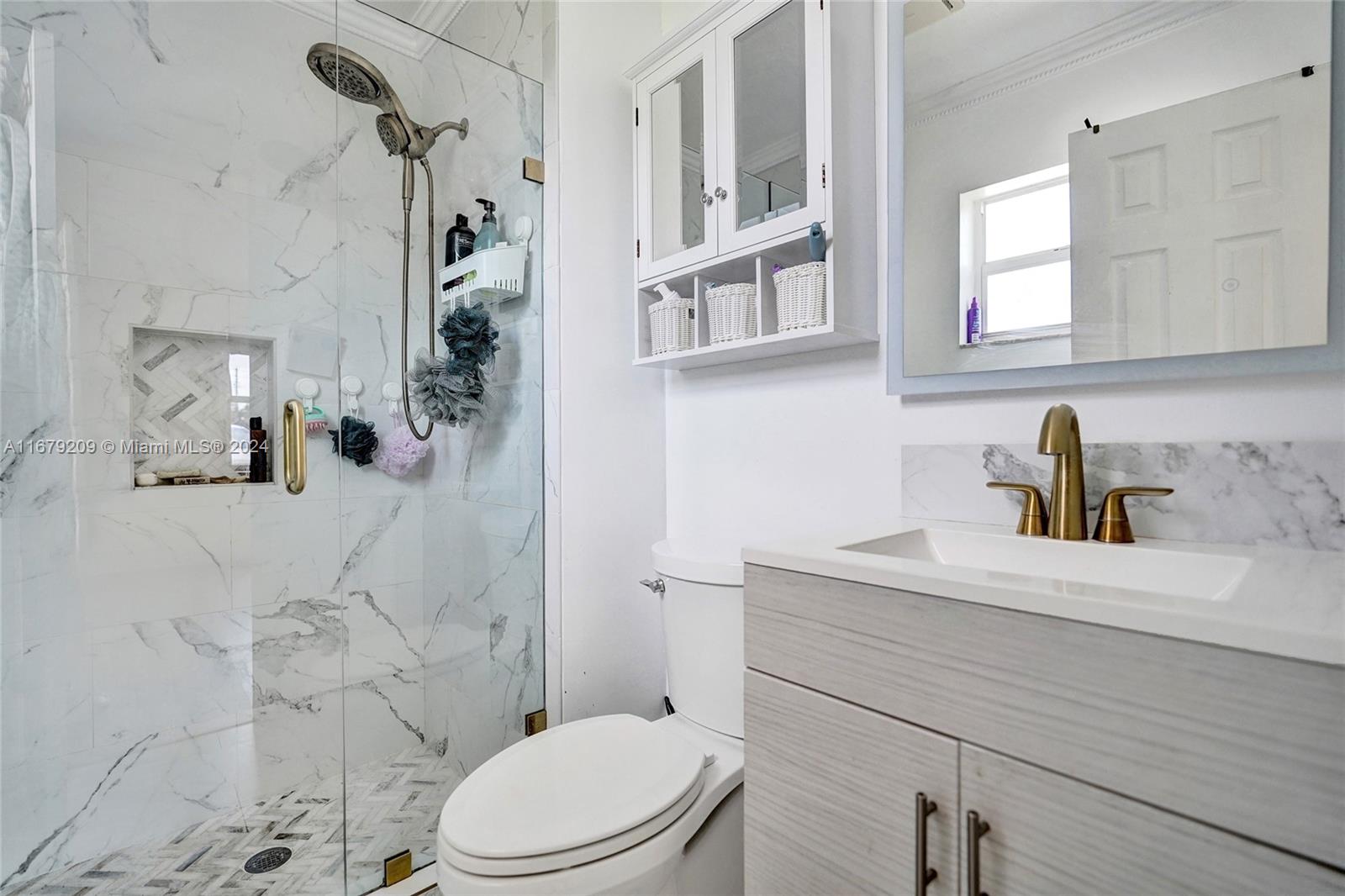 9737 Alaska Circle Boca Raton, FL 33434 - Photo 8 of 37 a bathroom with a sink a toilet and shower