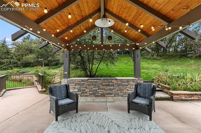 a patio with yard a patio and outdoor seating