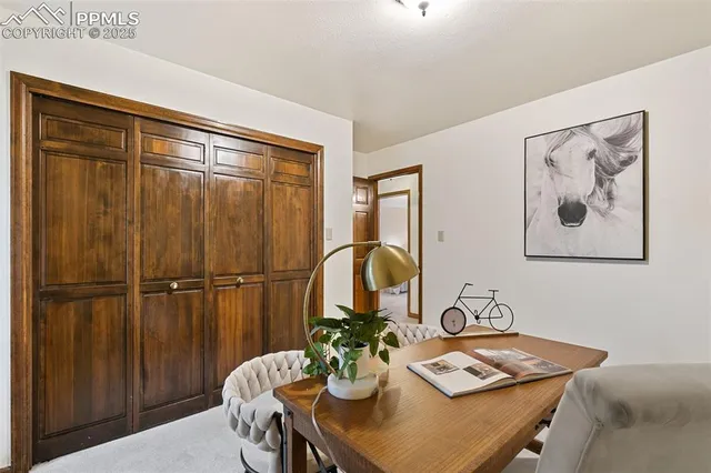 a dining room with furniture and window