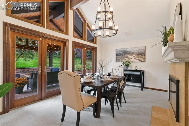 a view of a dining room with furniture window and outside view