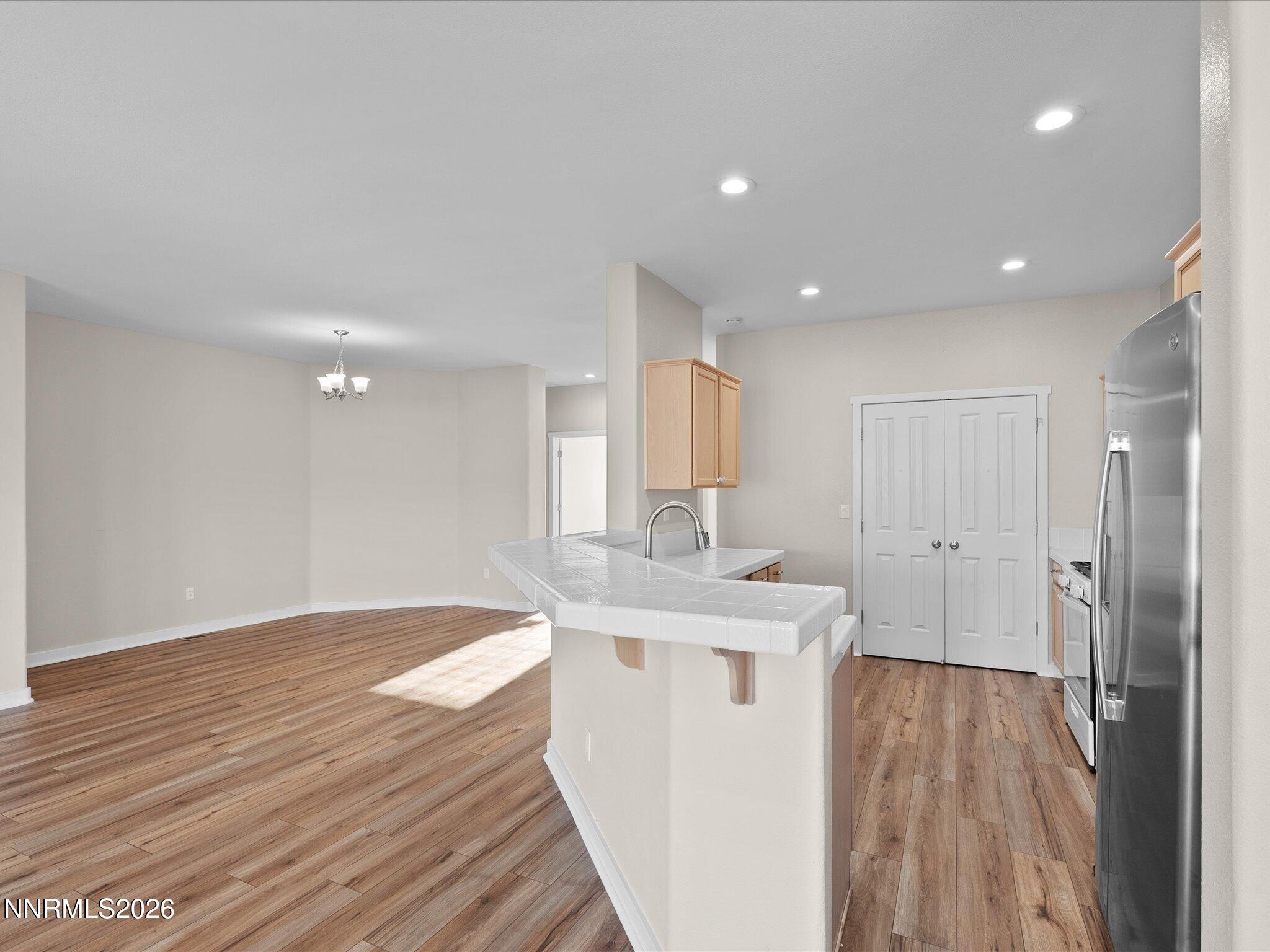 5570 Knoll View Way Sparks, NV 89436 - Photo 23 of 69 a view of a kitchen cabinets a sink and wooden floor