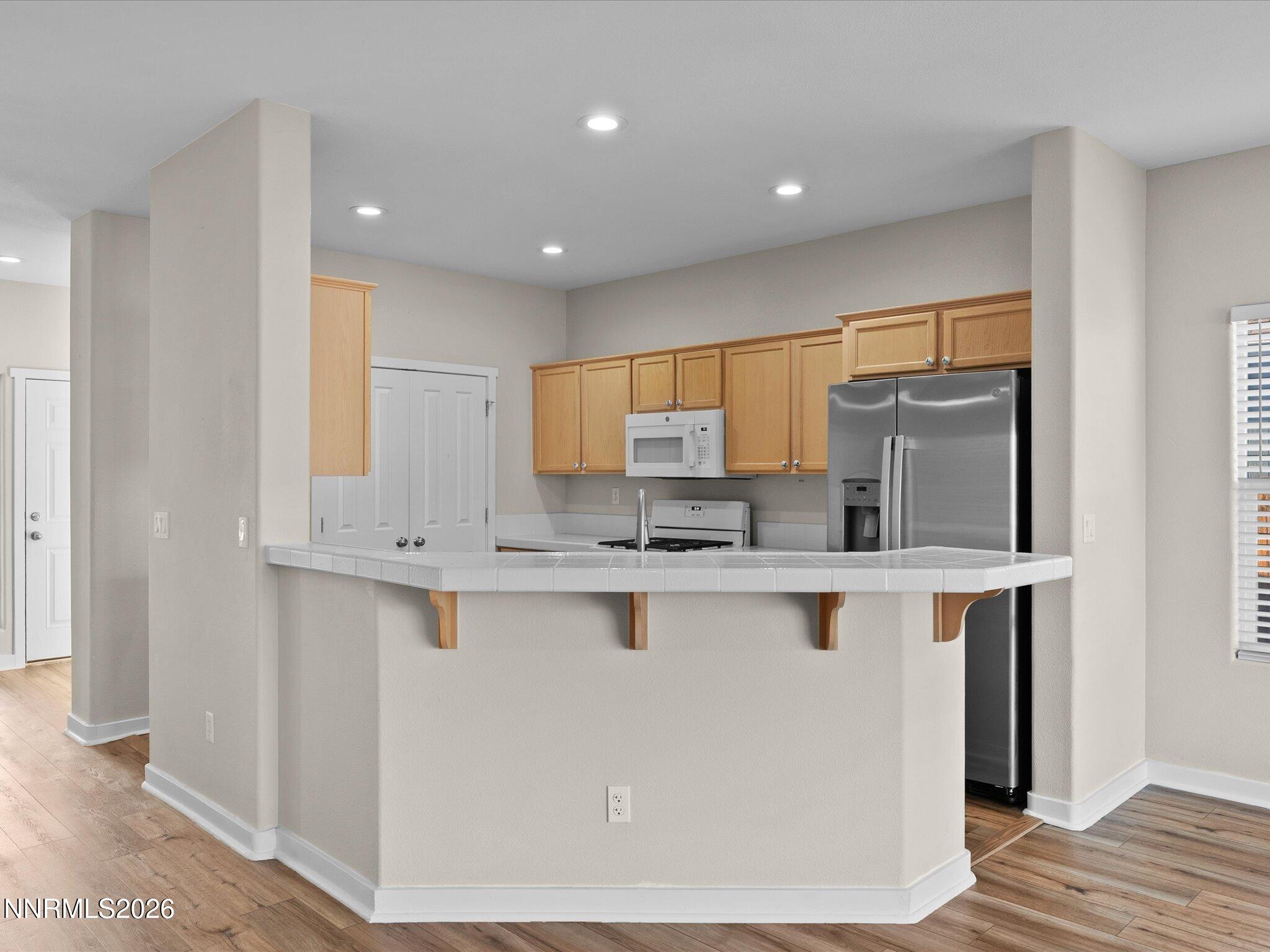 5570 Knoll View Way Sparks, NV 89436 - Photo 28 of 69 a kitchen with stainless steel appliances a sink and a refrigerator
