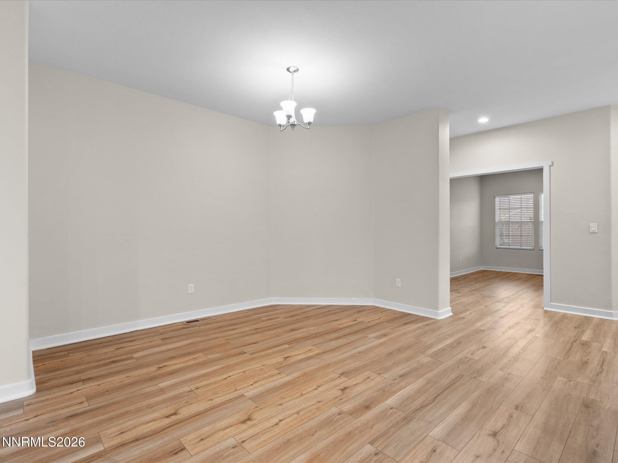 5570 Knoll View Way Sparks, NV 89436 - Photo 31 of 69 wooden floor in an empty room with a window