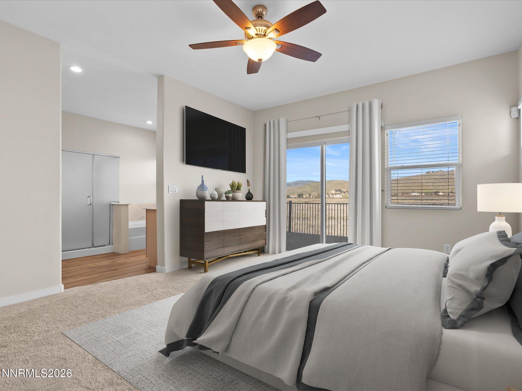 5570 Knoll View Way Sparks, NV 89436 - Photo 33 of 69 a bedroom with a bed and a flat screen tv