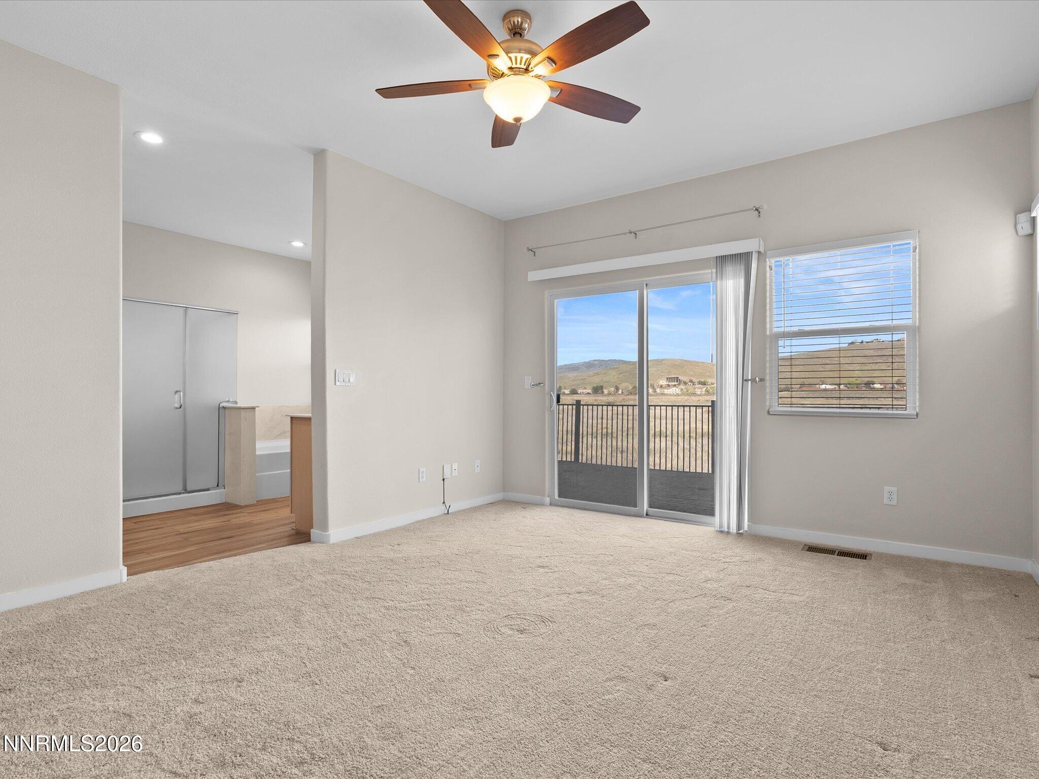5570 Knoll View Way Sparks, NV 89436 - Photo 34 of 69 a view of a room with cabinet and a ceiling fan