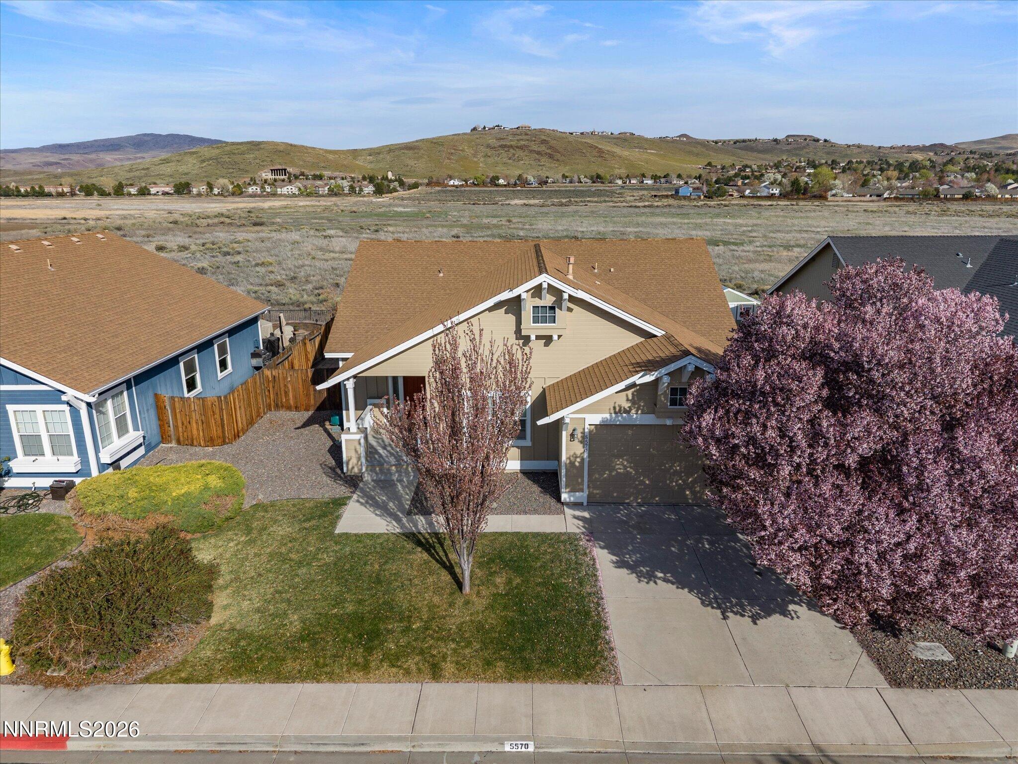 5570 Knoll View Way Sparks, NV 89436 - Photo 67 of 69 a view of a lake with a yard and a large window