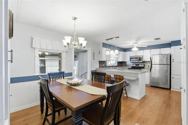 a view of a dining room with furniture and wooden floor