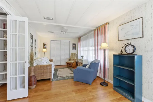 a living room with furniture and a large window