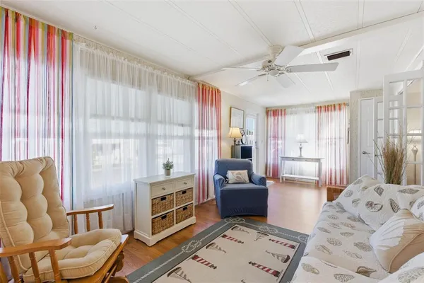 a living room with furniture and a window