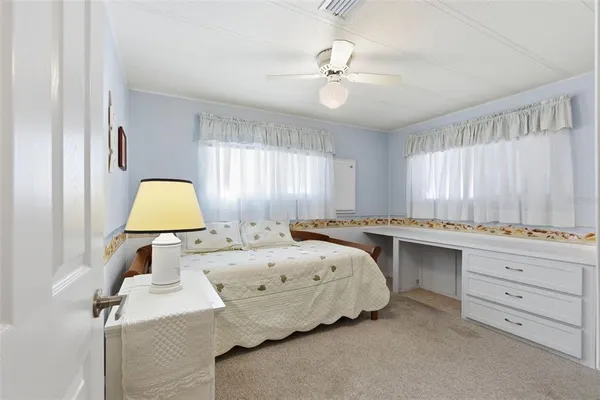 a room with a sink and a mirror