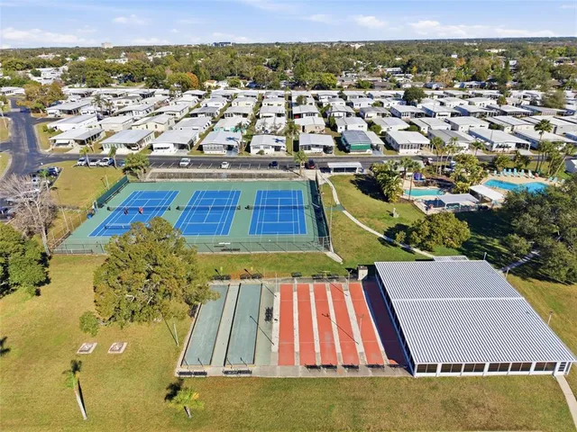 an aerial view of a residential apartment building with swimming pool