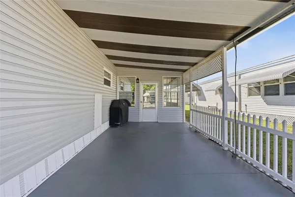 an aerial view of a house with a swimming pool yard and outdoor seating