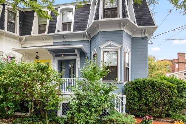 a living room with a couch and a fireplace