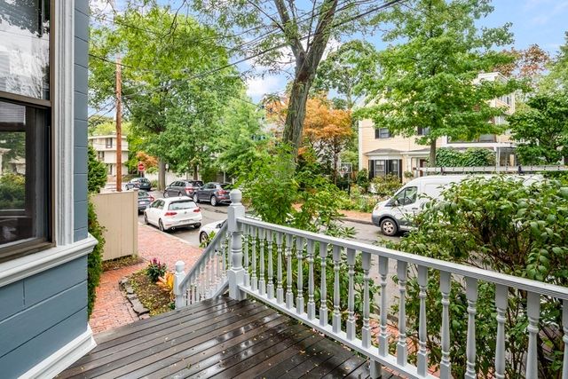 a view of a livingroom with furniture window and wooden floor