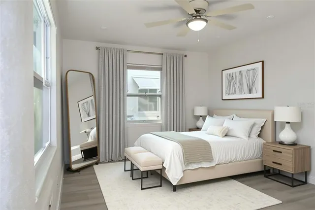 a bedroom with a bed and a night stand