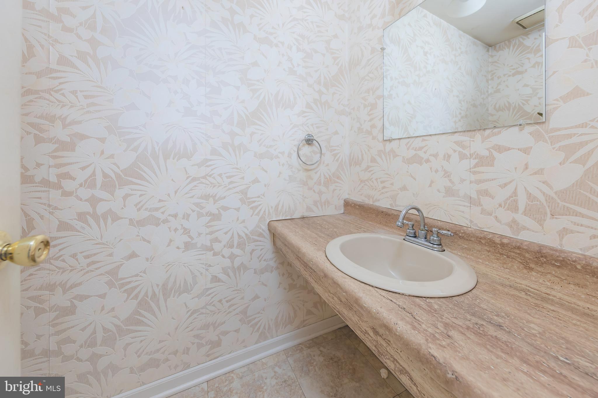 17 Framingham Road Beverly, NJ 08010 - Photo 11 of 24 a bathroom with a sink and a mirror