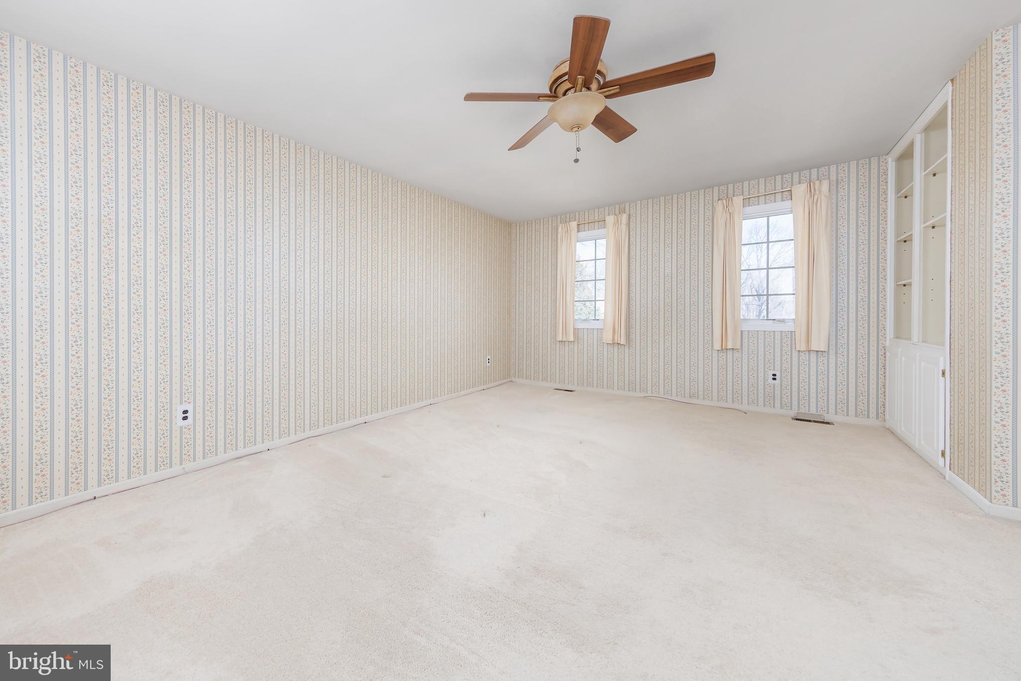 17 Framingham Road Beverly, NJ 08010 - Photo 12 of 24 an empty room with windows and ceiling fan