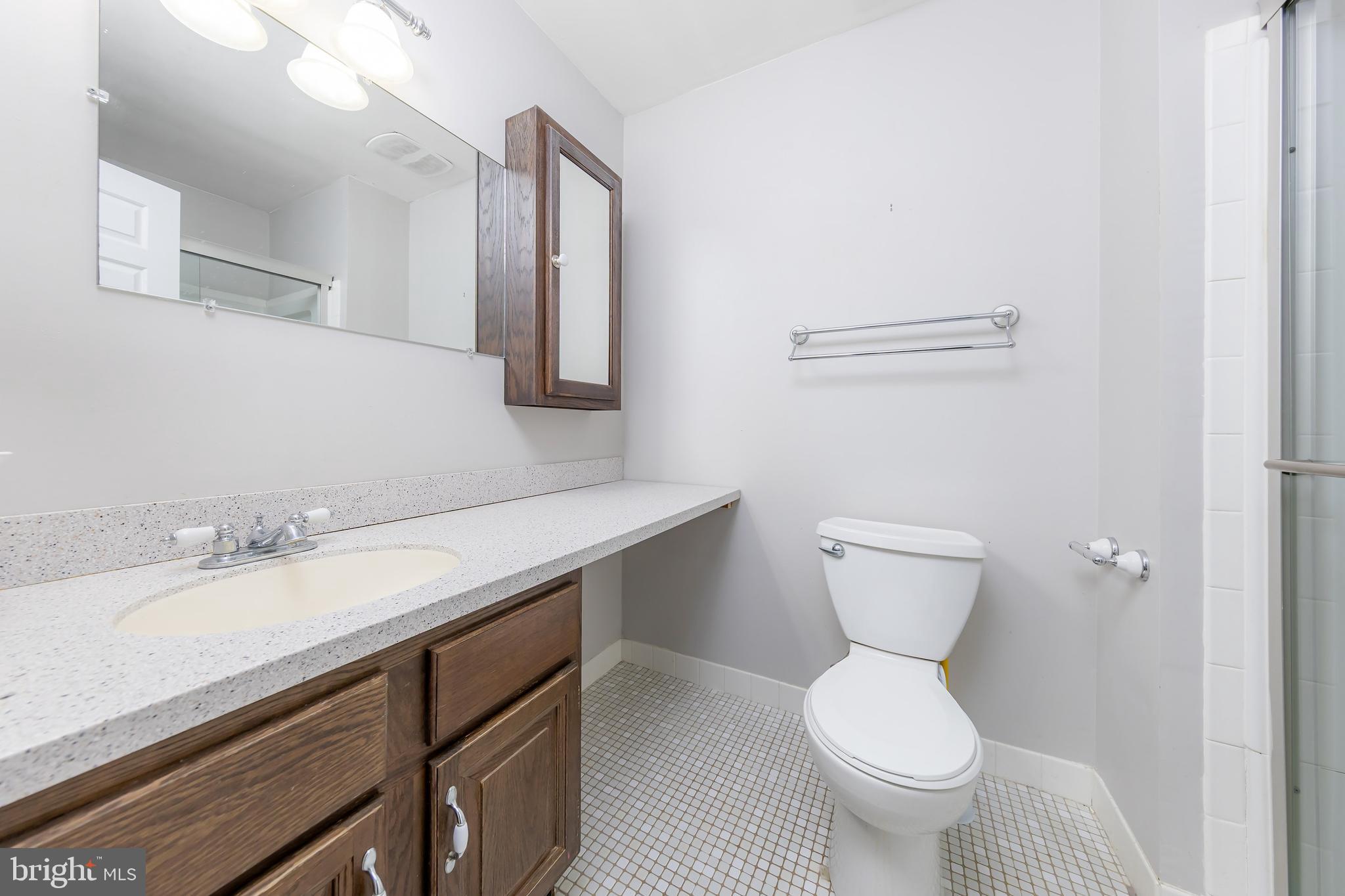 17 Framingham Road Beverly, NJ 08010 - Photo 13 of 24 a bathroom with a granite countertop toilet sink and mirror