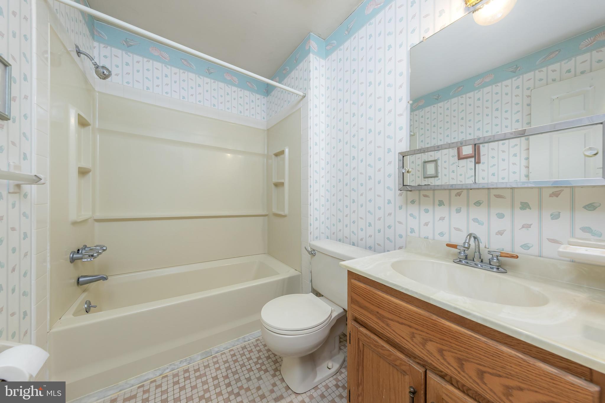 17 Framingham Road Beverly, NJ 08010 - Photo 17 of 24 a bathroom with a sink a toilet and a bathtub