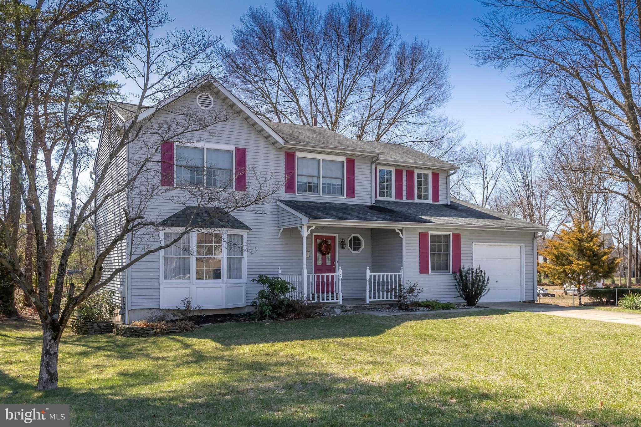17 Framingham Road Beverly, NJ 08010 - Photo 2 of 24 a front view of house with yard and trees in the background