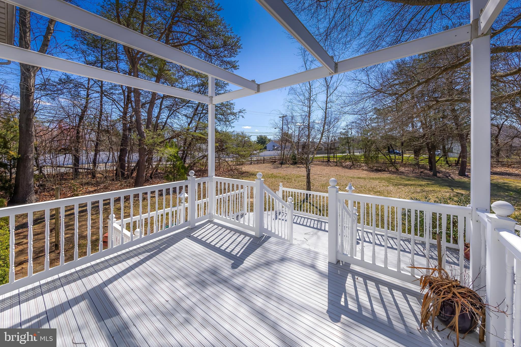 17 Framingham Road Beverly, NJ 08010 - Photo 21 of 24 a view of a wooden deck with a bench