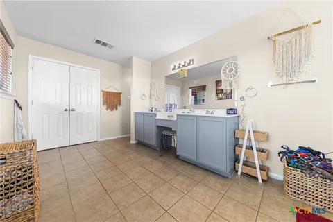 a kitchen with a sink and cabinets